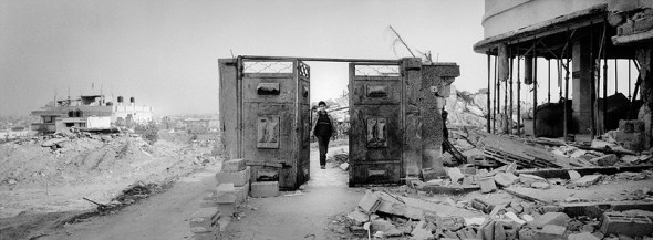 Gaza Strip January 25, 2009, A boy is walking through the destroyed entrance of the families house he used to live before Operation Cast Lead. In their neighborhood in east Jabalya (Hai-Al-Salam district) almost every house was destroyed.
