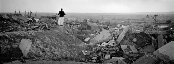 Gaza Strip January 23, Palestinian on the top of the rubble of his former home, which was destroyed by IDF during Operation Cast Lead.